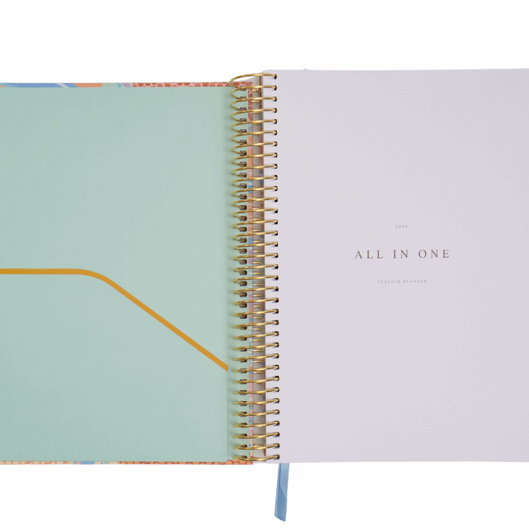 Open notebook with a light blue cover and white interior on a white background