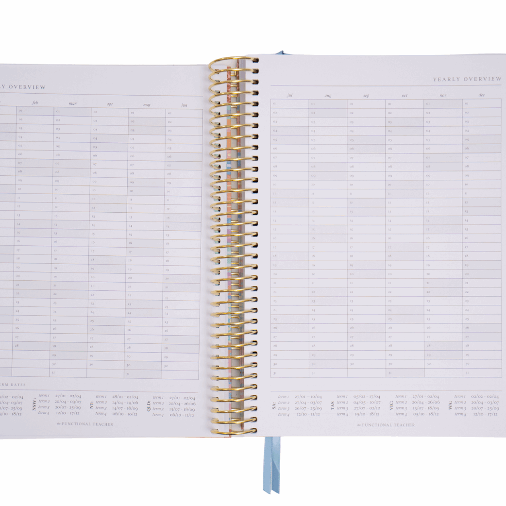 Open spiral-bound planner with grid layout on white background