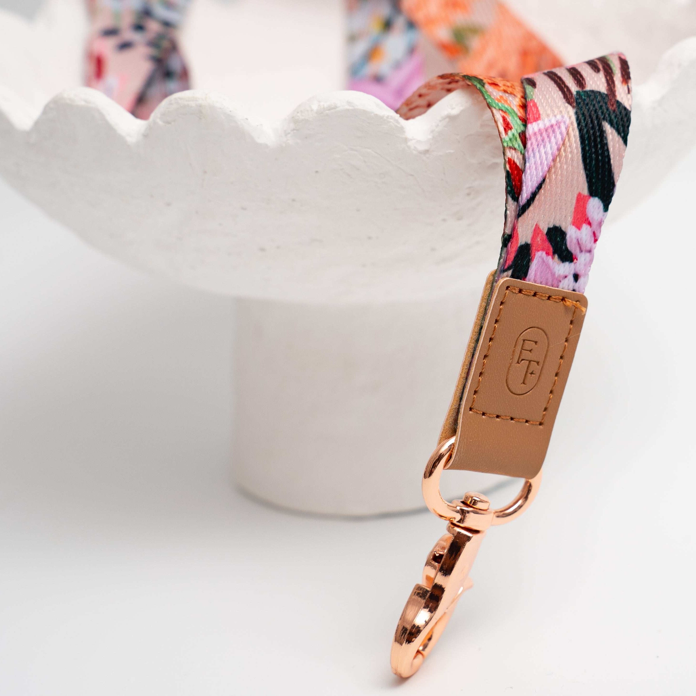 rose gold clasp and leather logo