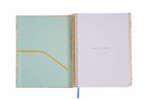Open notebook with a light blue cover and white interior on a white background